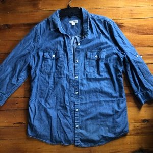 Blue button-up shirt.